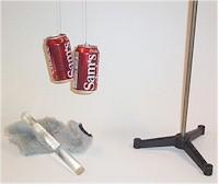 Rod, cloth, and two suspended aluminum cans