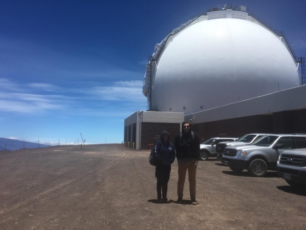 Smith and Tucker standing in front of Keck Observatory entrance, Mauna Kea