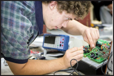 man working with electronics