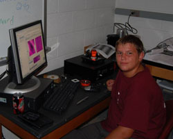 child at a desk with computer