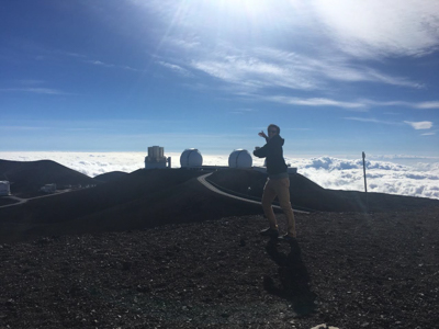 Tucker posing with Keck I and II in the background, Mauna Kea