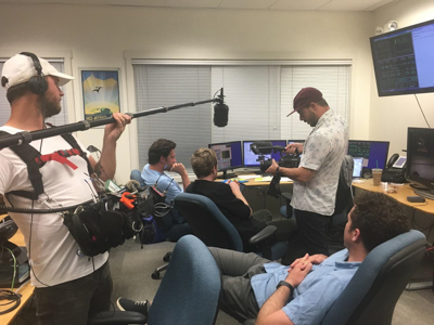 Tucker and the the film crew (including visiting microbiologist Luke McKay) discuss observing at Keck II Headquarters, Waimea